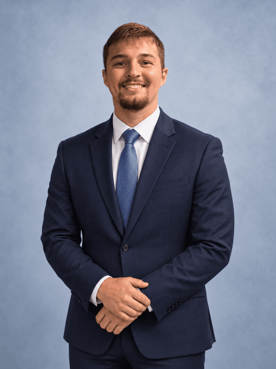 AI-generated portrait of Kaleb Jones in a navy suit